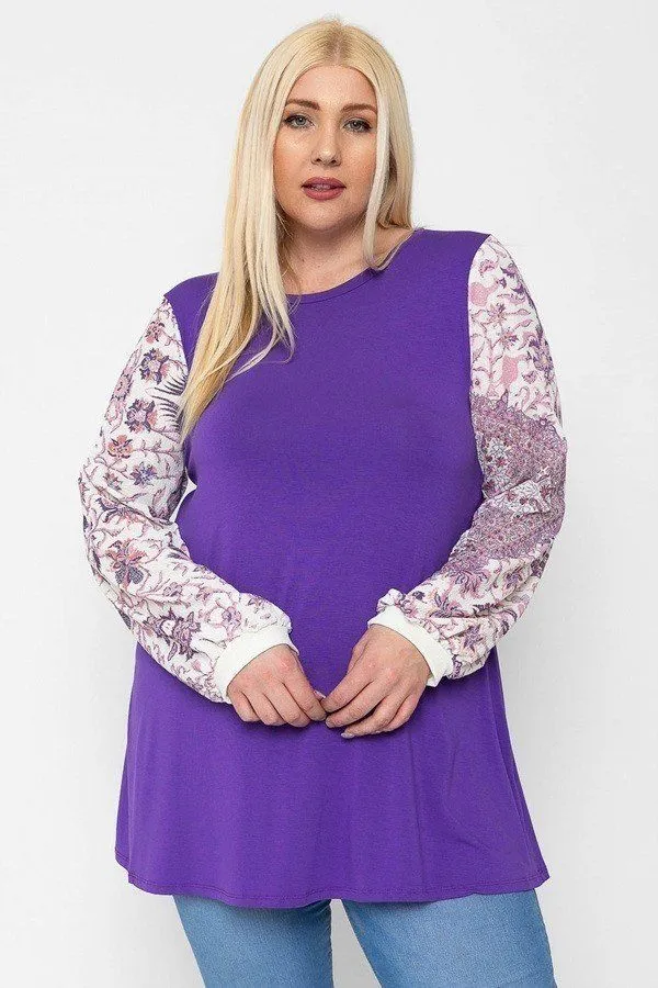 Floral Print, Contrasting Bubble Sleeves Tunic With A Round Neckline.